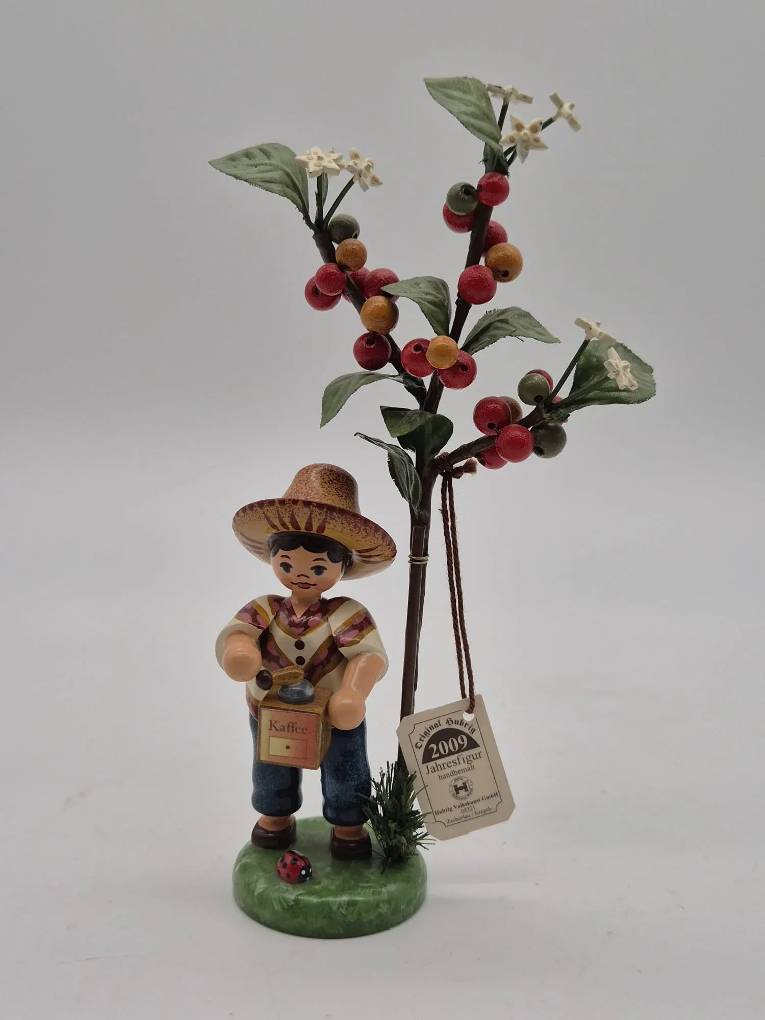Hubrig Volkskunst GmbH – Jahresfigur 2009 mit Beerenzweig, Erzgebirge