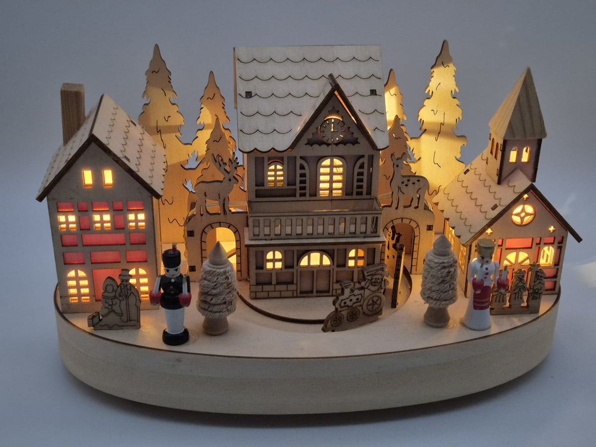 Beleuchtete Weihnachtsdorf - Spieluhr aus Holz mit Drehteller – Engel & Bergmann