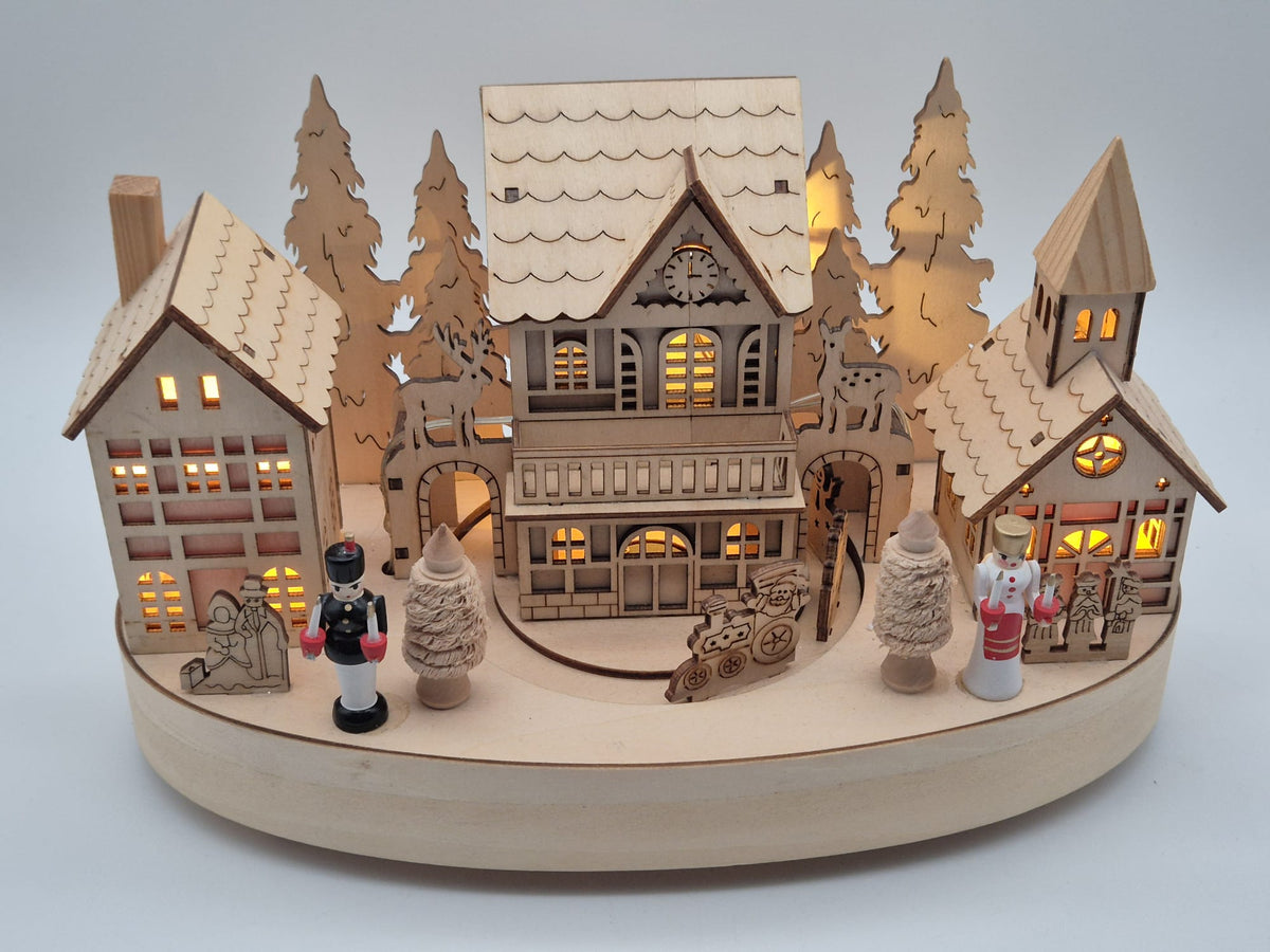 Beleuchtete Weihnachtsdorf - Spieluhr aus Holz mit Drehteller – Engel & Bergmann