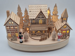 Beleuchtete Weihnachtsdorf - Spieluhr aus Holz mit Drehteller – Engel & Bergmann